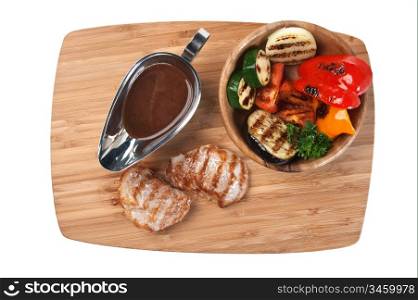 dishes of roast meat with vegetables and spices isolated on white background