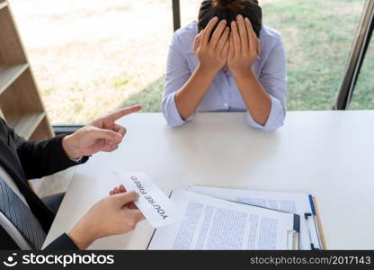 Dismissal concept a female officer fired by the boss looking very sad after she committed a big mistake.