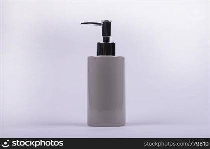 Dispenser for liquid soap on a light background. Hygiene products.