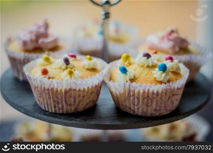 display of cake and cupcakes