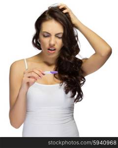 Displeased girl with pregnancy test isolated