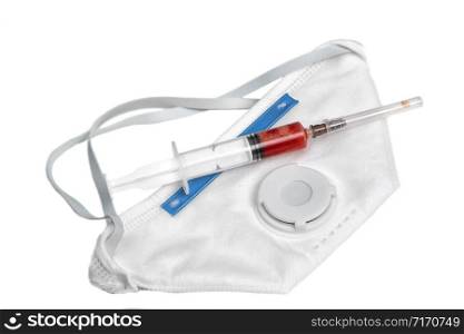 disposable mask and syringe with blood samples on a white isolated background