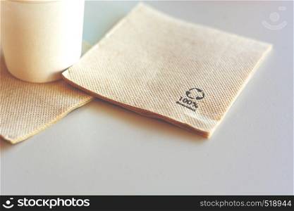 Disposable napkin made from recycled paper. Environmental protection and ecology.