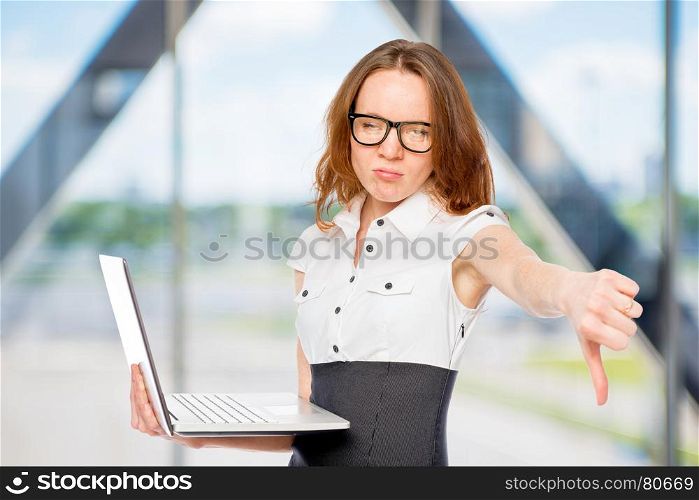 dissatisfied businesswoman shows thumb down. Failure in the office