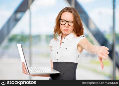 dissatisfied businesswoman shows thumb down. Failure in the office