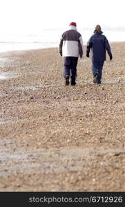 distant couple on beach