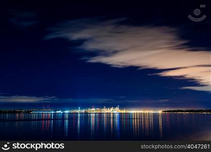 Distant skyline and city lights at night, Seattle, Washington, USA