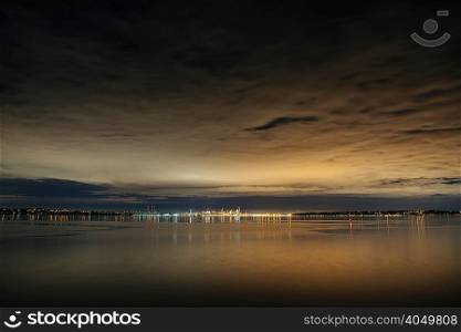 Distant view of city lights over Puget Sound at night, Seattle, Washington, USA