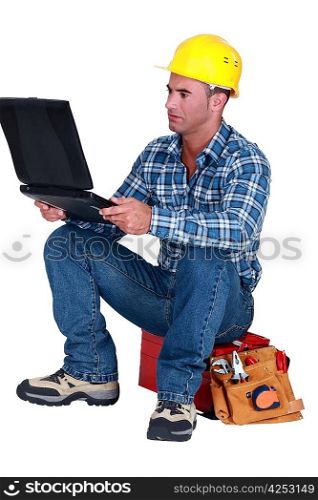 Distraught tradesman reading his emails