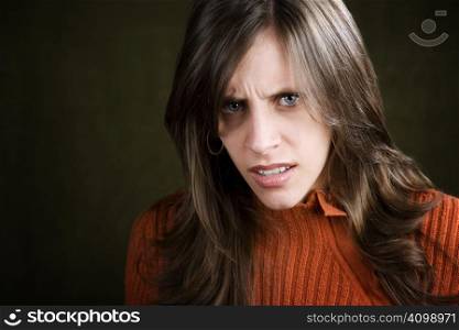 Distraught Young Woman in an Orange Sweater