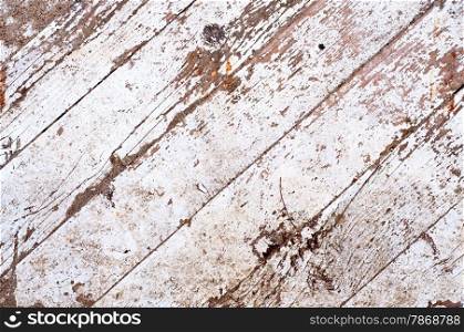 Distress wooden planks with peeled white paint.