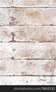 Distress wooden planks with peeled white paint.