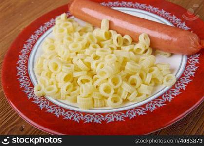 Ditalini pasta with sausage served in a ceramic bowl