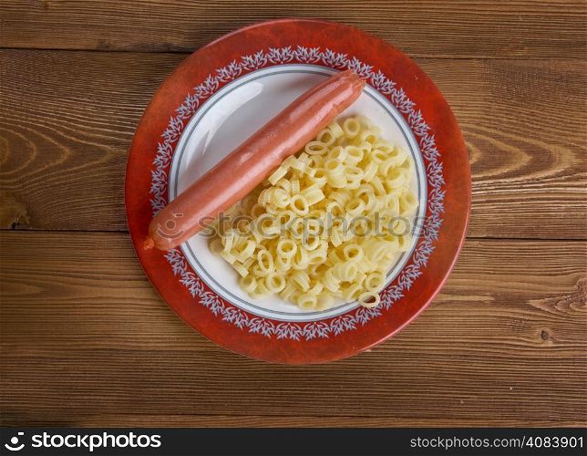 Ditalini pasta with sausage served in a ceramic bowl