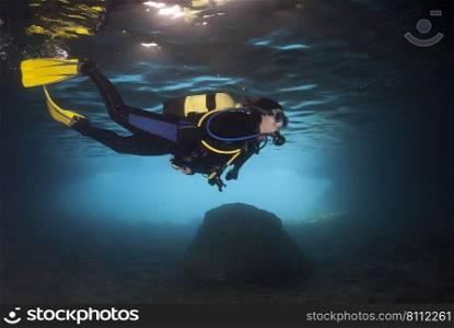 Diver exploring an underwater cavern in the Mediterranean