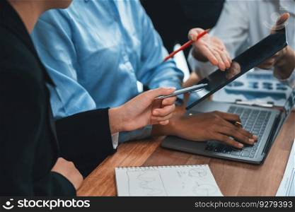 Diverse business people work together, discuss in corporate office. Professional teamwork discussing and pointing at laptop. Modern multicultural office worker. Concord. Modern multicultural office worker in corporate workplace. Concord