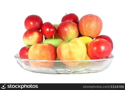 Diverse kind of apples in a glass bowl isolated on white