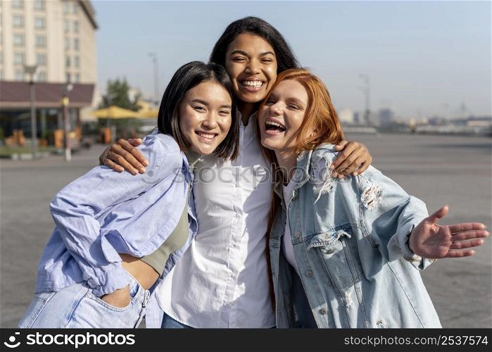 diverse women posing while smiling