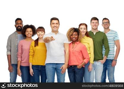 diversity, choice, ethnicity and people concept - international group of happy smiling men and women pointing finger on you over white