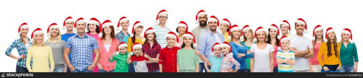 diversity, christmas and holidays concept - international multiethnic group of happy people in santa hats. group of happy people in santa hats