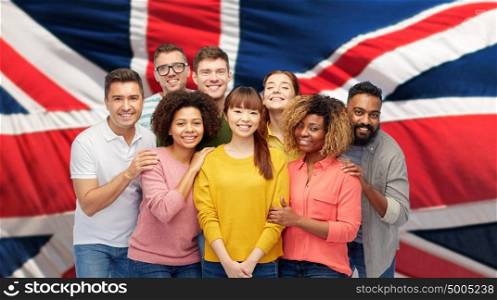 diversity, immigration, friendship and people concept - international group of happy smiling men and women over british flag background. international group of happy smiling people