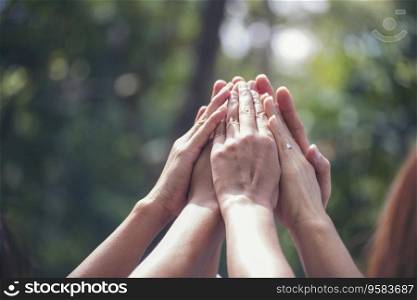 Diversity multiethnic high five group of business people success team hands together. Collaborate Volunteer friendship hands raise up mission Business partner. Group of teamwork high five together