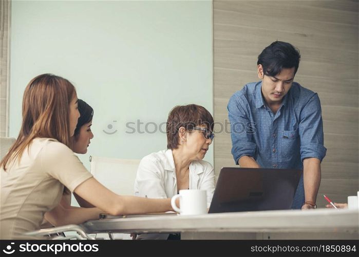 Diversity multiethnic team group of business people Present meeting conference room brainstorming business graph, chart. Multicultural Teamwork collaborate business team meeting together trust partner