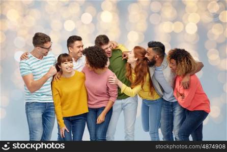 diversity, race, ethnicity and people concept - international group of happy men and women laughing over holidays lights background