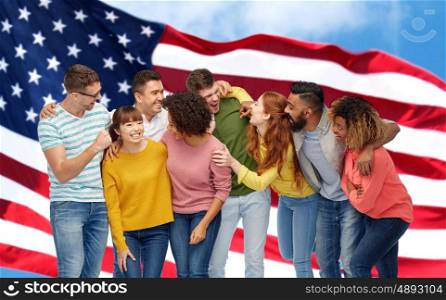 diversity, race, ethnicity and people concept - international group of happy men and women laughing over american flag background