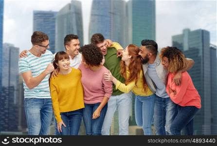 diversity, race, ethnicity and people concept - international group of happy men and women laughing over singapore city skyscrapers background