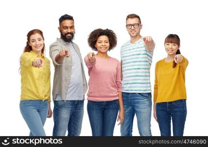 diversity, race, ethnicity and people concept - international group of happy smiling men and women pointing finger on you over white