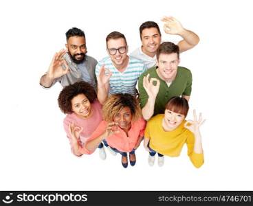 diversity, race, ethnicity and people concept - international group of happy smiling men and women showing ok hand sign over white