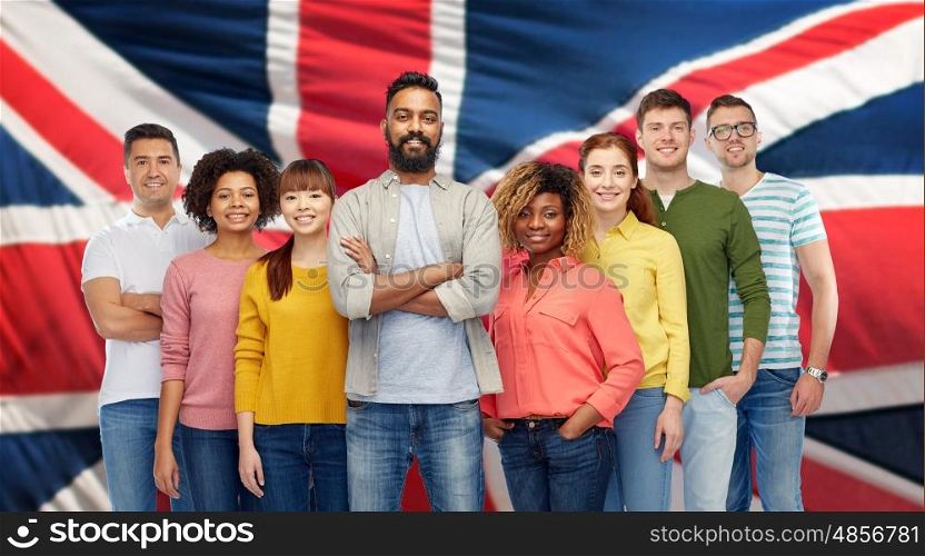 diversity, race, ethnicity and people concept - international group of happy smiling men and women over british or english flag background