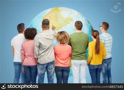 diversity, race, ethnicity and people concept - international group of happy smiling men and women pointing finger to something over white