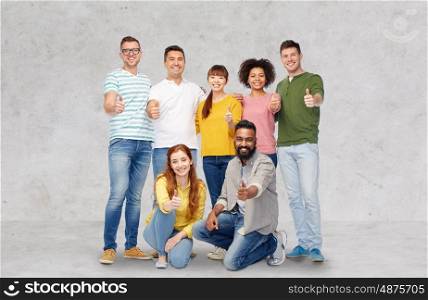 diversity, race, ethnicity and people concept - international group of happy smiling men and women showing thumbs up over gray background