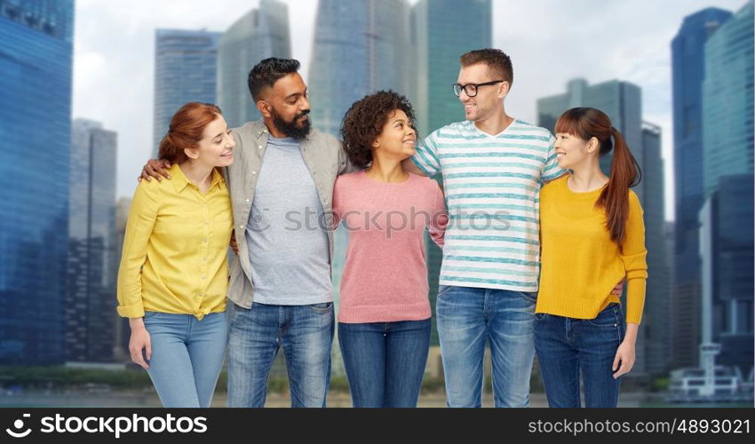 diversity, race, ethnicity and people concept - international group of happy smiling men and women over singapore city skyscrapers background