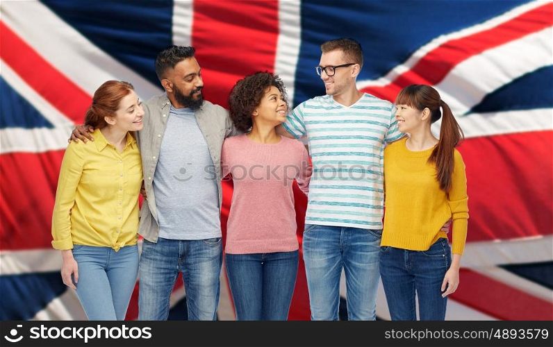 diversity, race, ethnicity and people concept - international group of happy smiling men and women over english flag background