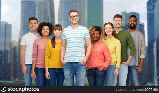 diversity, race, ethnicity and people concept - international group of happy smiling men and women over singapore city skyscrapers background. international group of happy smiling people