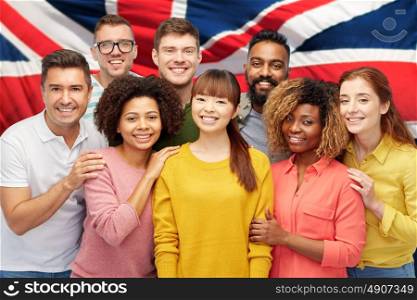 diversity, race, ethnicity and people concept - international group of happy smiling men and women over english flag background. international group of happy smiling people