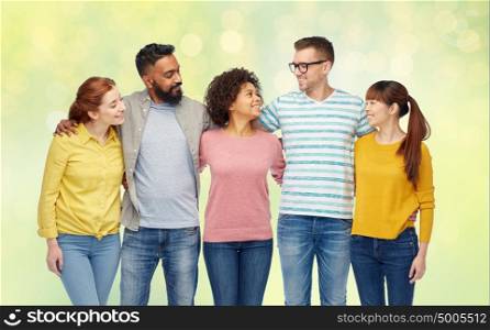 diversity, race, ethnicity and people concept - international group of happy smiling men and women over summer green lights background. international group of happy smiling people