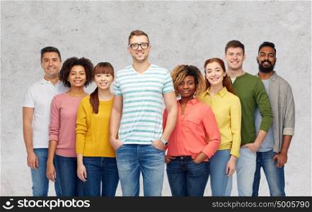 diversity, race, ethnicity and people concept - international group of happy smiling men and women over gray concrete background. international group of happy smiling people