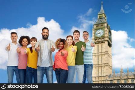 diversity, race, ethnicity and people concept - international group of happy smiling men and women showing thumbs up over london city and big ben tower background. group of people showing thumbs up over big ben