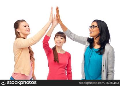diversity, race, ethnicity and people concept - international group of happy smiling different women over white doing high five. international group of happy women doing high five