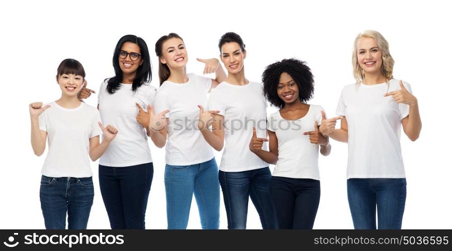 diversity, race, ethnicity and people concept - international group of happy smiling different women pointing to white blank t-shirts. international group of women in white t-shirts