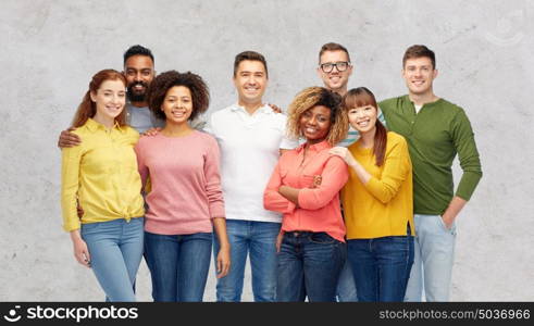 diversity, race, ethnicity and people concept - international group of happy smiling men and women over gray background. international group of happy smiling people