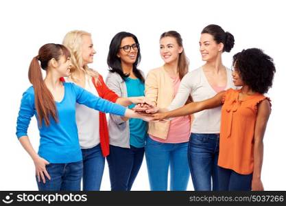 diversity, race, ethnicity and people concept - international group of happy smiling different women over white holding hands together. international group of women with hands together