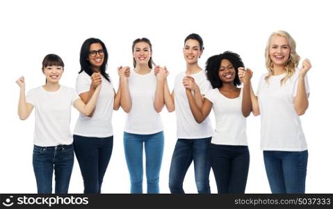 diversity, race, ethnicity and people concept - international group of happy smiling different women in white blank t-shirts holding hands. international group of happy smiling women