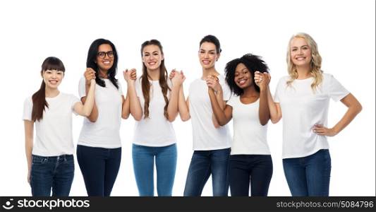 diversity, race, ethnicity and people concept - international group of happy smiling different women in white blank t-shirts holding hands. international group of happy smiling women. international group of happy smiling women