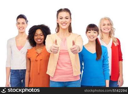 diversity, race, ethnicity and people concept - international group of happy smiling different women over white showing thumbs up. international group of women showing thumbs up