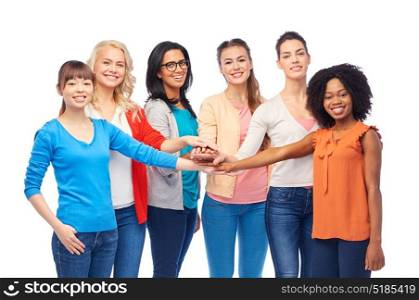 diversity, race, ethnicity and people concept - international group of happy smiling different women over white holding hands together. international group of women with hands together